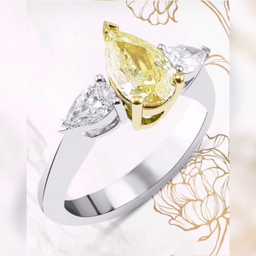 Пръстен с диамант 1 карат цена и качество от най-висок клас. Пръстен с жълт диамант и два бели диаманта капки с прелестна красота за диамантен годежен пръстен или пръстен за годишнина.