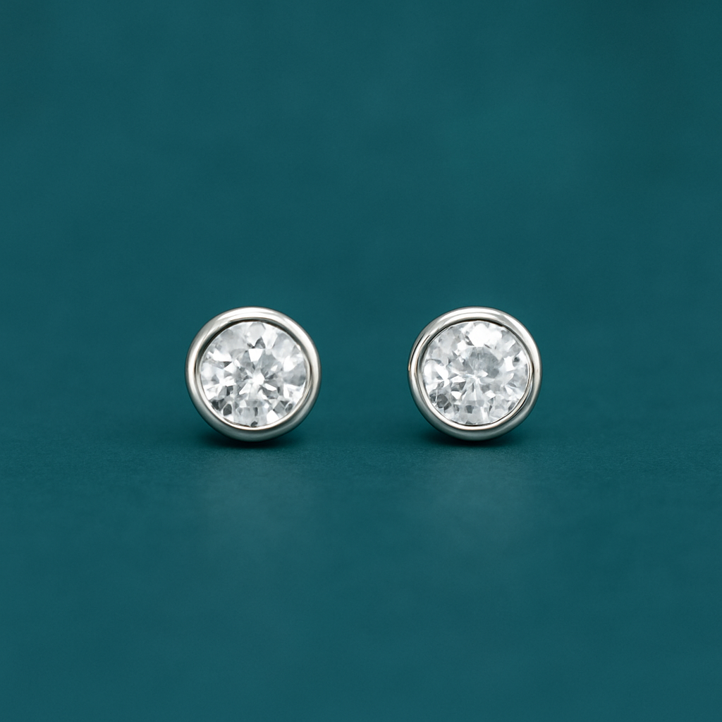 Обеци от бяло злато с диаманти в обков 0.12 карата