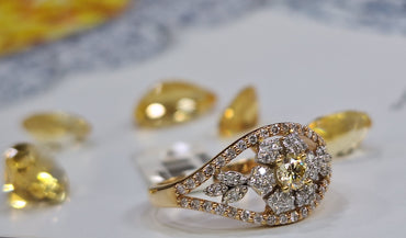 Дамски пръстен от розово злато с жълт диамант и бели диаманти 0.56 карата