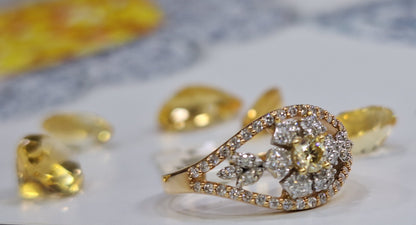 Дамски пръстен от розово злато с жълт диамант и бели диаманти 0.56 карата