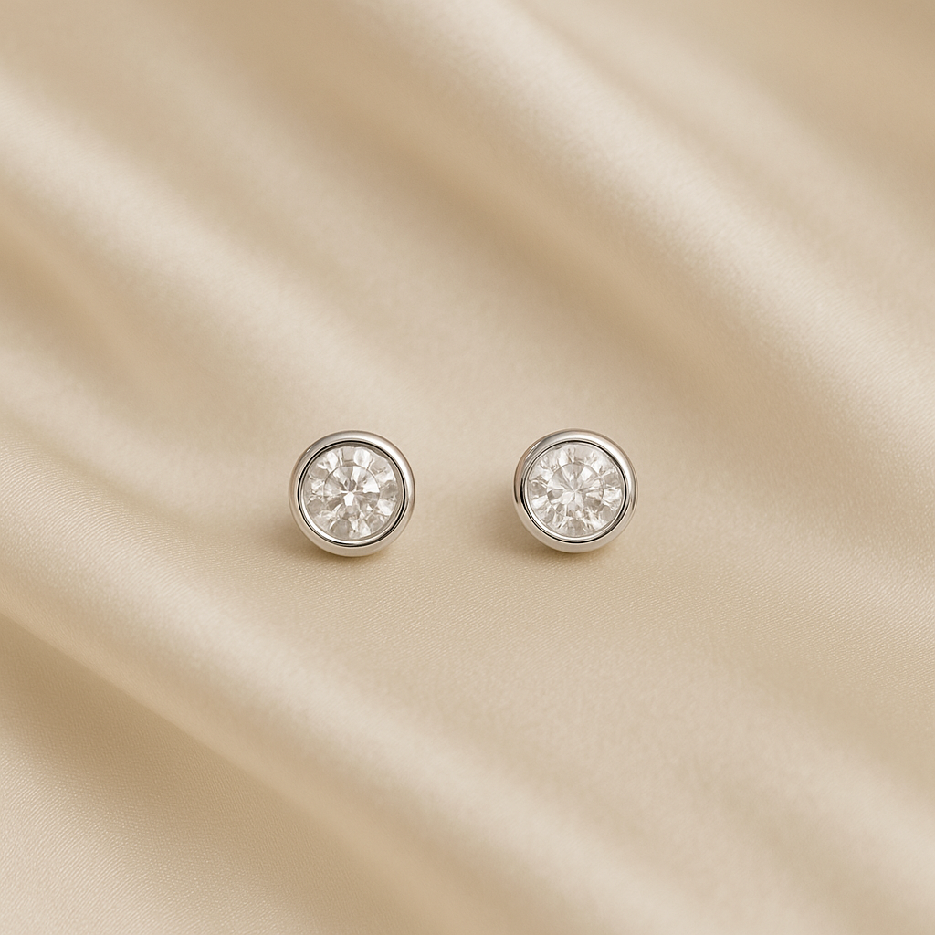 Обеци от бяло злато с диаманти в обков 0.12 карата