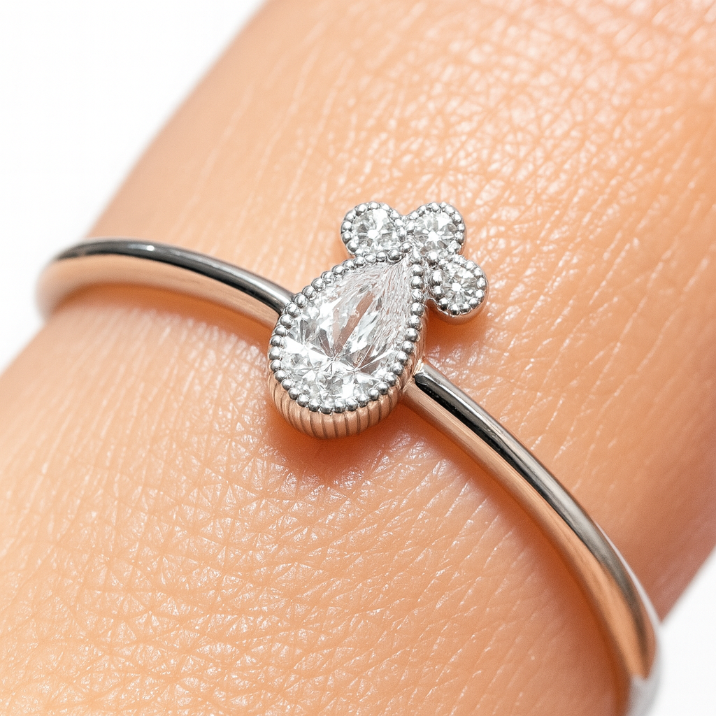 White gold ring with drop diamond and diamonds 0.18 carats