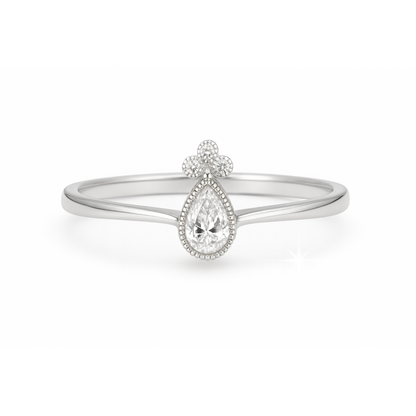 White gold ring with drop diamond and diamonds 0.18 carats